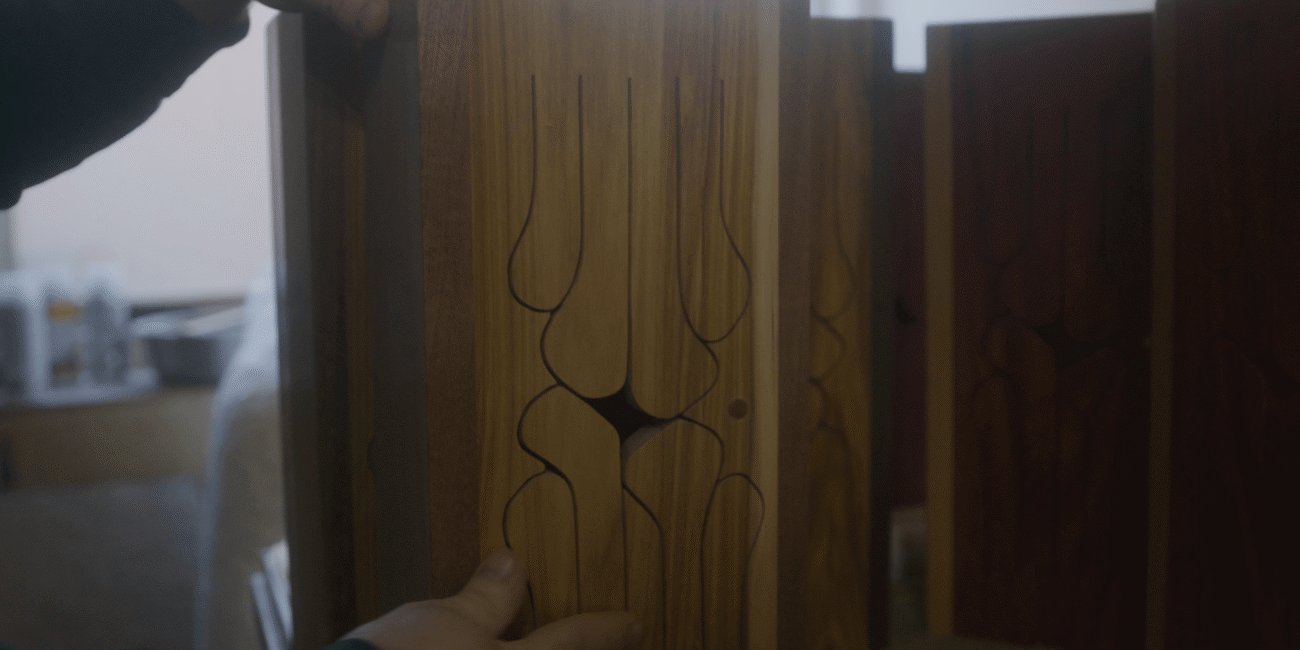 Close-up of carved wooden drum tongues inside the Hardwood Music Company workshop
