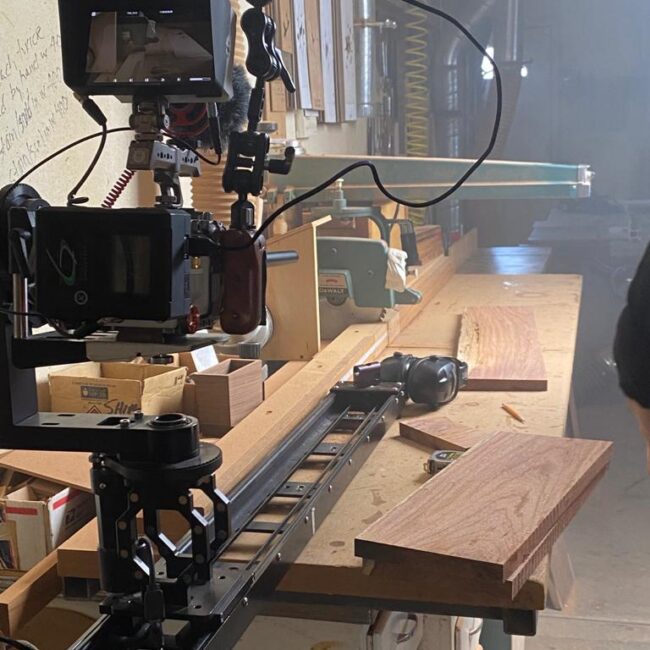 Cinema camera setup filming a handcrafted wooden percussion instrument